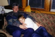 Nikki cuddling with Dad on Christmas (2000)